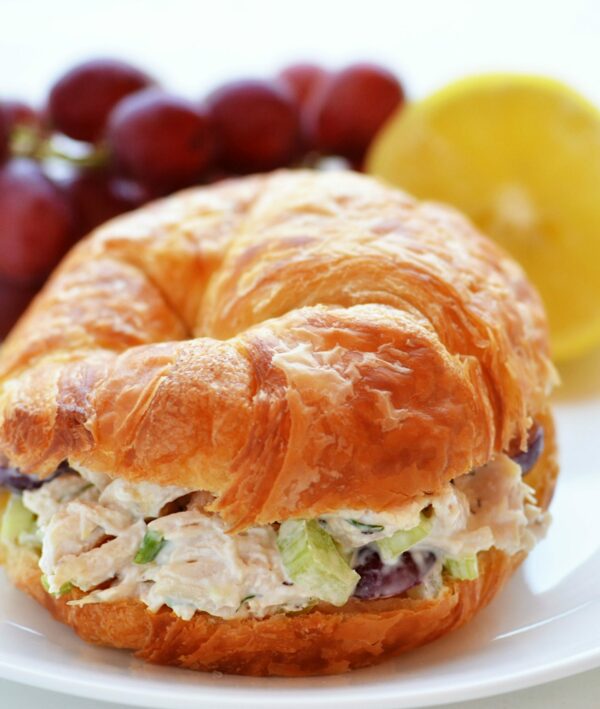 chicken salad on croissant with fruit